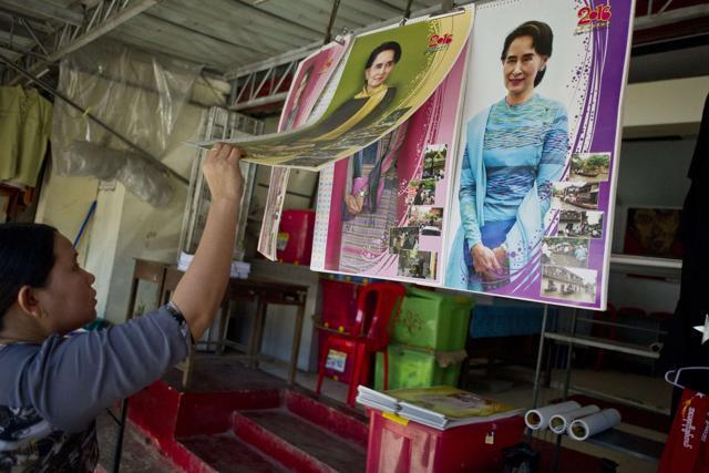 A woman buys an Aung San Suu Kyi calendar at a souvenir shop outside of the headquarters of the National League for Democracy party(NLD) in Yangon. (AFP) A woman buys an Aung San Suu Kyi calendar at a souvenir shop outside of the headquarters of the National League for Democracy party(NLD) in Yangon. (AFP)