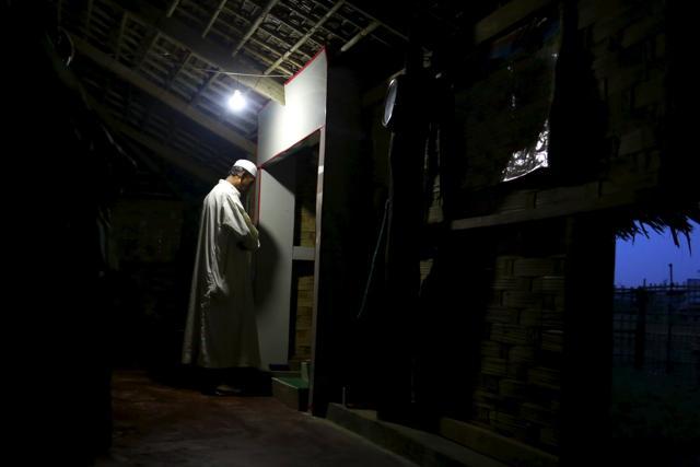 A Muslim Rohingya man prays at a temporary mosque at a refugee camp outside Sittwe. (REUTERS) A Muslim Rohingya man prays at a temporary mosque at a refugee camp outside Sittwe. (REUTERS)