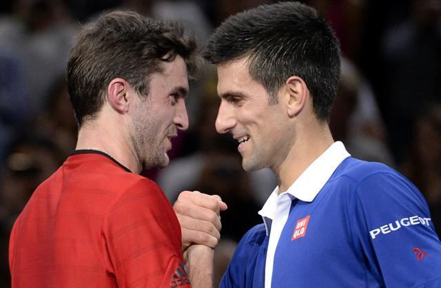 Novak Djokovic, right, shakes hands with France's Gilles Simon at the net after winning their third-round match at the Paris Masters in Paris on November 5, 2015. (AFP Photo) Novak Djokovic, right, shakes hands with France's Gilles Simon at the net after winning their third-round match at the Paris Masters in Paris on November 5, 2015. (AFP Photo)