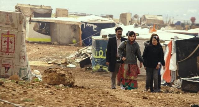 Zia Yousafzai and Malala Yousafzai and Syrian refugee Rimah in Syrian Refugee Tent Camp in Jordan. Zia Yousafzai and Malala Yousafzai and Syrian refugee Rimah in Syrian Refugee Tent Camp in Jordan.