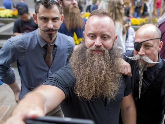 Contestants pose together for a selfie as they gather to promote the National Beard and Moustache Championships in New York, November 6, 2015. (REUTERS)