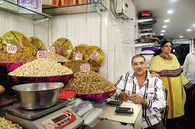 Changing tastes: Dinesh Chawla of Lahore Dry Fruits says the demand for dry fruits has gone down with new kinds of sweets available. (Photo by Saumya Khandelwal/ Hindustan Times) (Hindustan Times)