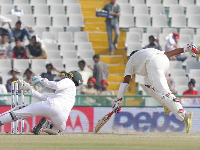 India’s Cheteshwar Pujara completes a run as South African wicket-keeper Dane Vilas attempts to run him out. (Gurpreet Singh/HT Photo) India’s Cheteshwar Pujara completes a run as South African wicket-keeper Dane Vilas attempts to run him out. (Gurpreet Singh/HT Photo)
