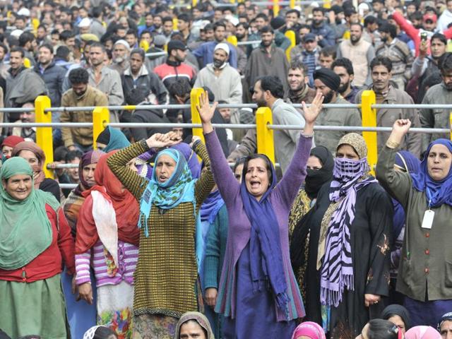 Supporters cheer as Prime Minister Narendra Modi addresses people at Sher-e-Kashmir Stadium in Srinagar on Saturday. (Waseem Andrabi/ HT)
