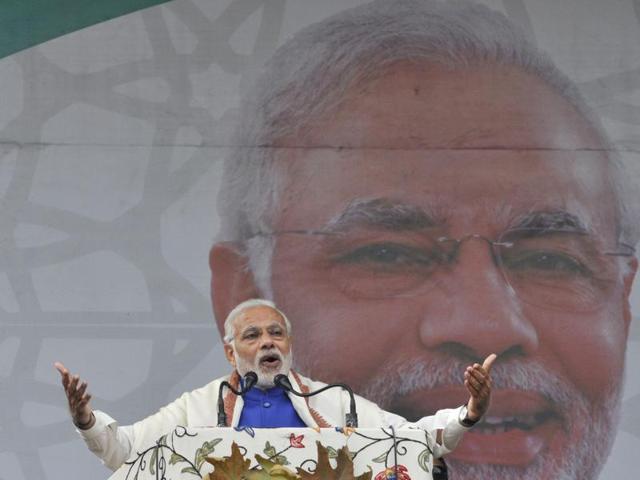 Prime Minister Narendra Modi addressing people at Sher-e-Kashmir Stadium in Srinagar on Saturday. The PM announced a financial package of Rs 80,000 crore for Kashmir. (Waseem Andrabi/ HT)