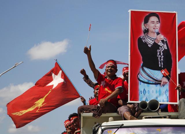 In this Nov. 4, 2015 file photo supporters of Myanmar opposition leader Aung San Suu Kyi's National League for Democracy party wave their party flag during a campaign rally for the upcoming general election in Meiktila, Mandalay Region, Myanmar. (AP Photo) In this Nov. 4, 2015 file photo supporters of Myanmar opposition leader Aung San Suu Kyi's National League for Democracy party wave their party flag during a campaign rally for the upcoming general election in Meiktila, Mandalay Region, Myanmar. (AP Photo)