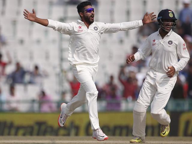India's Ravindra Jadeja and Cheteshwar Pujara (R) celebrate the dismissal of South Africa's Vernon Philander (not pictured) during the third day of the first Test. (Reuters Photo) India's Ravindra Jadeja and Cheteshwar Pujara (R) celebrate the dismissal of South Africa's Vernon Philander (not pictured) during the third day of the first Test. (Reuters Photo)