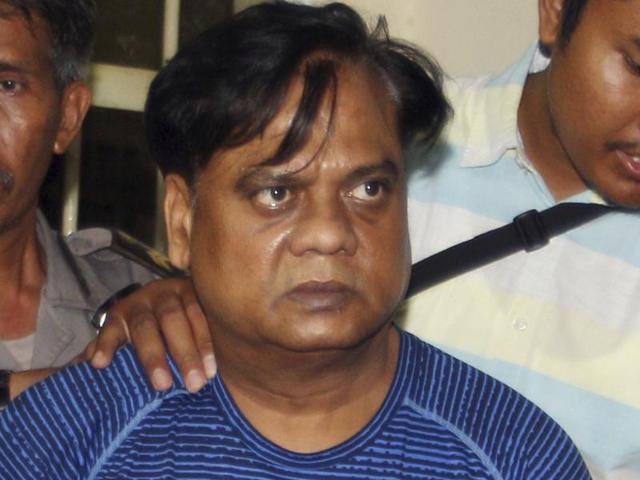Indonesian police escort Chhota Rajan to the airport in Bali. (REUTERS) Indonesian police escort Chhota Rajan to the airport in Bali. (REUTERS)