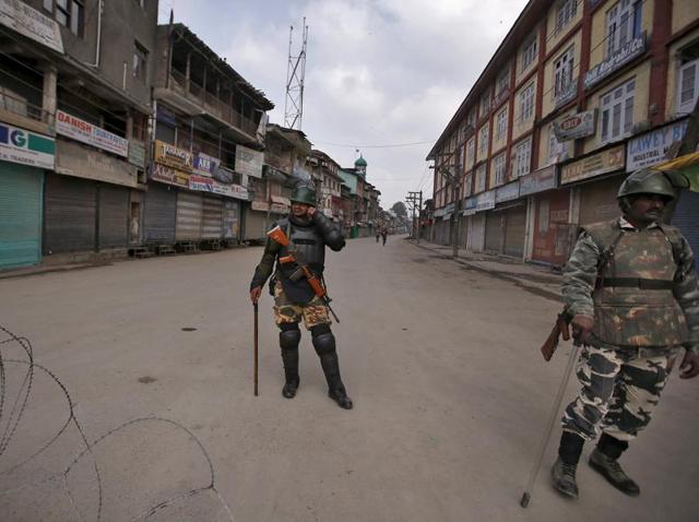 Security personnel stand guard along a deserted street during restrictions in Srinagar. Security forces have detained Kashmiri separatists to prevent them marching in protest during Prime Minister Narendra Modi's visit, police said, raising tensions in the disputed territory. (Reuters Photo) Security personnel stand guard along a deserted street during restrictions in Srinagar. Security forces have detained Kashmiri separatists to prevent them marching in protest during Prime Minister Narendra Modi's visit, police said, raising tensions in the disputed territory. (Reuters Photo)