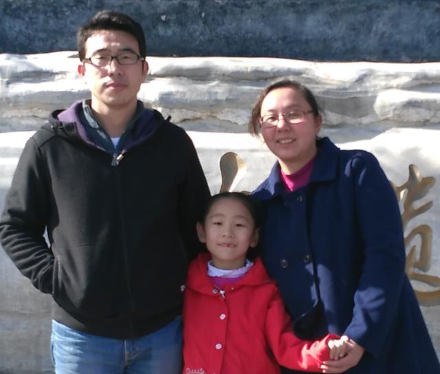 Liu Bo and his wife with their daughter. Liu Bo and his wife with their daughter.