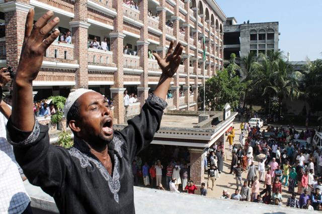 The father of Samiul Alam Rajon, a 13-year-old boy who was murdered in July, reacts on the court grounds after the sentencing of his son's killers in Sylhet on November 8, 2015. (AFP Photo) The father of Samiul Alam Rajon, a 13-year-old boy who was murdered in July, reacts on the court grounds after the sentencing of his son's killers in Sylhet on November 8, 2015. (AFP Photo)
