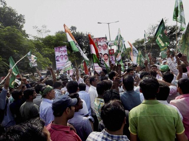 Supporters celebrate the Grand Alliance’s victory in Bihar assembly elections in Patna on Sunday. (PTI)