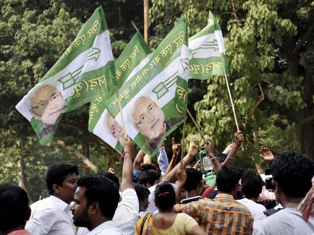 Supporters of Nitish Kumar celebrate in Patna on Sunday. (PTI)