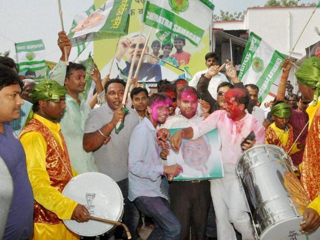 JD(U) supporters celebrate the Mahagathbandhan's victory in Bihar assembly elections in Patna on Sunday. (PTI)