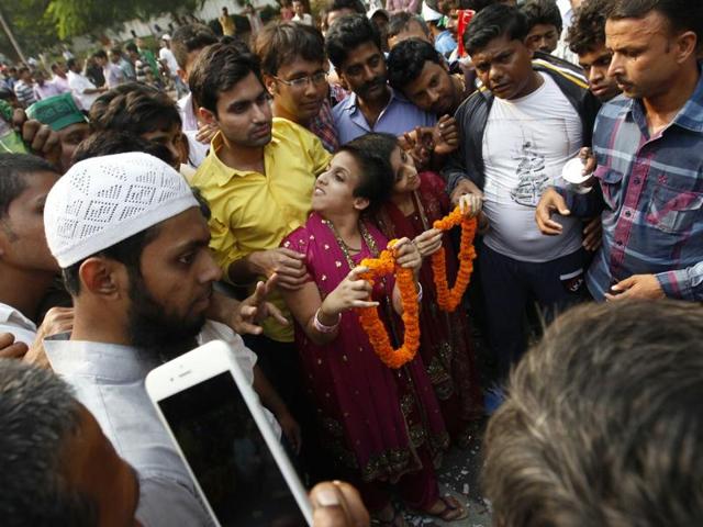 Conjoined twins - Saba sisters arrive to congratulate Bihar chief minister Nitish Kumar at his residence on the vote counting day of the Bihar Assembly elections, in Patna, on Sunday, November 08, 2015. (Photo by Ajay Aggarwal/ Hindustan Times)
