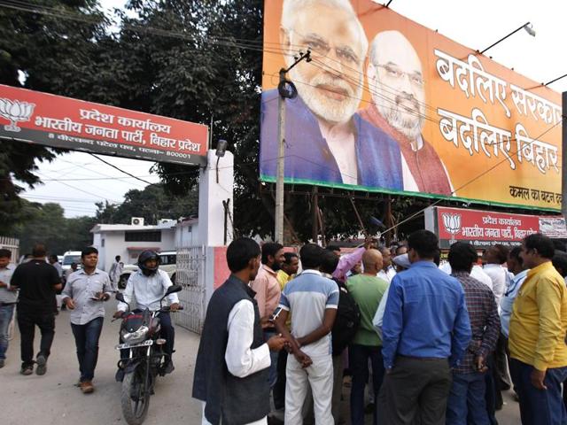 BJP supporters stand outside party office in Patna on the eve of Bihar assembly results. (Ajay Aggarwal/ht photo)