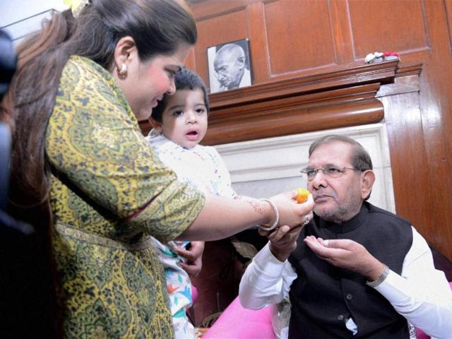 JD(U) President Sharad Yadav’s daughter offers sweets on the counting day of Bihar assembly elections, in New Delhi on Sunday, November 8. (PTI)
