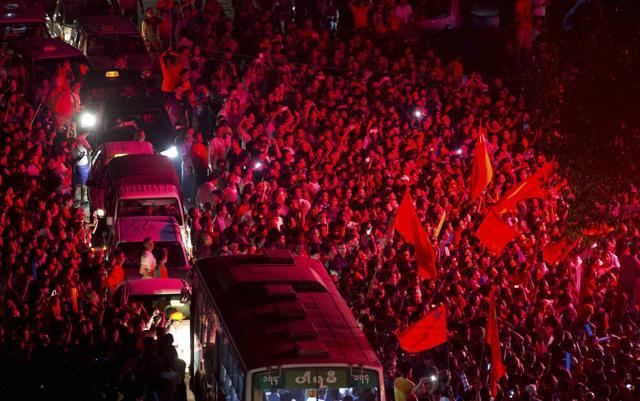 Traffic attempts to make it's way through supporters of Myanmar's National League for Democracy party as they wait for election results to be posted outside the NLD headquarters in Yangon. (AP Photo) Traffic attempts to make it's way through supporters of Myanmar's National League for Democracy party as they wait for election results to be posted outside the NLD headquarters in Yangon. (AP Photo)