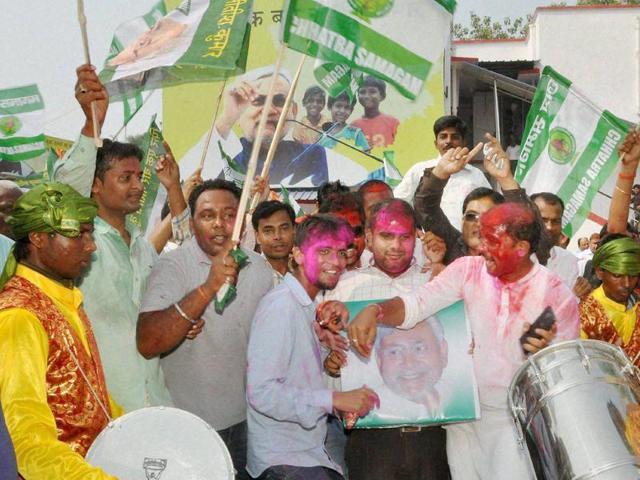 JD(U) supporters celebrate the Mahagathbandhan's victory in Bihar assembly elections in Patna on Sunday. (PTI) JD(U) supporters celebrate the Mahagathbandhan's victory in Bihar assembly elections in Patna on Sunday. (PTI)