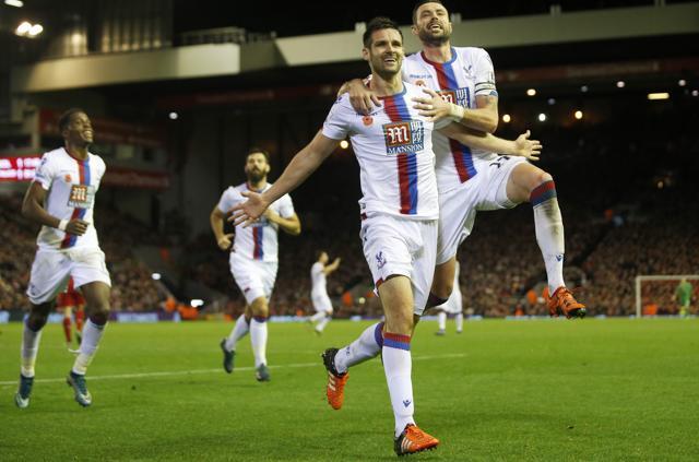Crystal Palace's Scott Dann celebrates scoring his side’s second goal with Damien Delaney (R) during the EPL match against Liverpool at Anfield on November 8, 2015. (Reuters Photo) Crystal Palace's Scott Dann celebrates scoring his side’s second goal with Damien Delaney (R) during the EPL match against Liverpool at Anfield on November 8, 2015. (Reuters Photo)