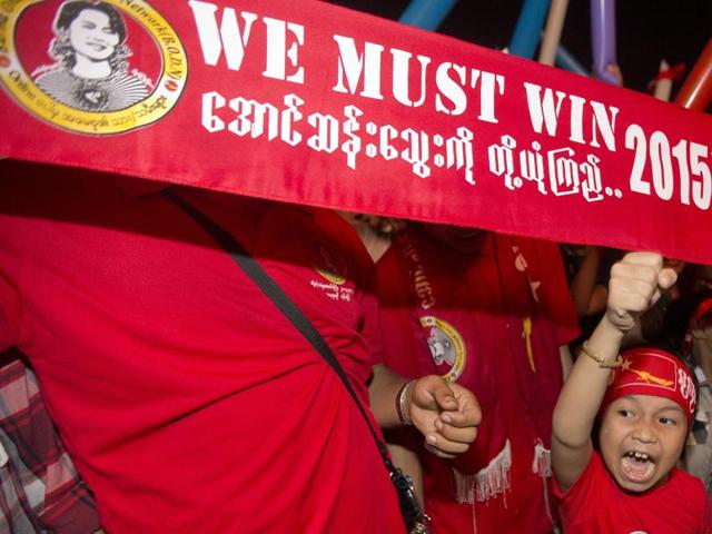 Supporters of Myanmar's National League for Democracy party cheer as election results are posted outside the NLD headquarters in Yangon, Myanmar. (AP Photo)
