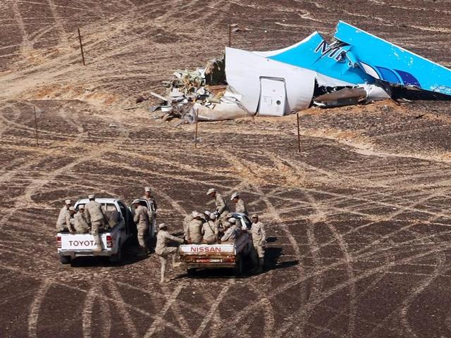 Egyptian Military on cars approach a plane's tail at the wreckage of a passenger jet bound for St. Petersburg in Russia that crashed in Hassana, Egypt, on Sunday. (AP Photo) Egyptian Military on cars approach a plane's tail at the wreckage of a passenger jet bound for St. Petersburg in Russia that crashed in Hassana, Egypt, on Sunday. (AP Photo)
