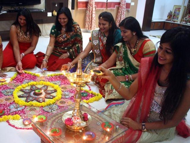 Girls prepare Rangoli a day ahead of Diwali in Indore on Tuesday. (Shankar Mourya/HT photo) Girls prepare Rangoli a day ahead of Diwali in Indore on Tuesday. (Shankar Mourya/HT photo)
