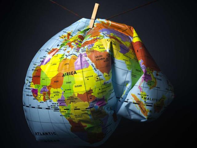 An illustration made in Paris shows a deflated Earth globe. Earth has heated up by one degree Celsius (1.6 degrees Fahrenheit), Britain's weather office said, as greenhouse gases hit record levels just weeks before a crucial climate summit in Paris, which runs from November 30 to December 11. (AFP) An illustration made in Paris shows a deflated Earth globe. Earth has heated up by one degree Celsius (1.6 degrees Fahrenheit), Britain's weather office said, as greenhouse gases hit record levels just weeks before a crucial climate summit in Paris, which runs from November 30 to December 11. (AFP)