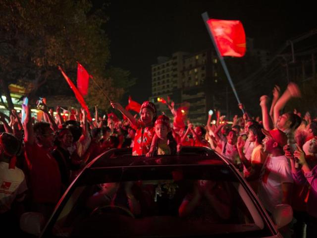 Supporters of Aung San Suu Kyi's pro-democracy party cheered early results from Myanmar's historic election, with hopes boosted of sweeping gains to carry it to power after decades of military dominance. (AFP) Supporters of Aung San Suu Kyi's pro-democracy party cheered early results from Myanmar's historic election, with hopes boosted of sweeping gains to carry it to power after decades of military dominance. (AFP)