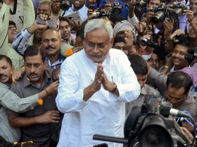 Nitish Kumar is surrounded by media personnel as he greets supporters after victory in Bihar elections.(AP)