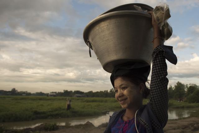 A young woman carries a basket on her head in Dala on November 11, 2015. Aung San Suu Kyi's opposition appeared on the verge of a landslide election win that could finally reset Myanmar after decades of army control, as a top member of the ruling party said they had "lost completely". (AFP) A young woman carries a basket on her head in Dala on November 11, 2015. Aung San Suu Kyi's opposition appeared on the verge of a landslide election win that could finally reset Myanmar after decades of army control, as a top member of the ruling party said they had "lost completely". (AFP)