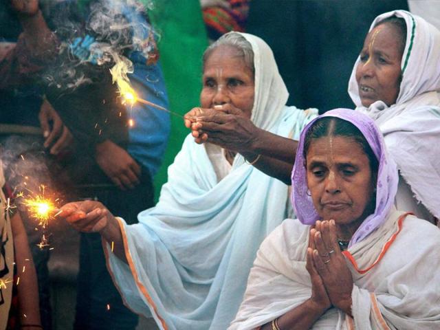 Widows of Vrindavan celebrate Diwali organised by Sulabh International at Vrindavan in Uttar Pradesh on Tuesday. (PTI)