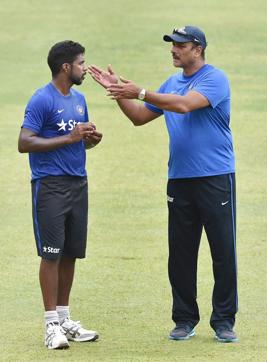 Varun Aaron with team director Ravi Shastri during a practice session ahead of the 2nd Test match against South Africa at Chinnaswamy Stadium in Bengaluru. (PTI) Varun Aaron with team director Ravi Shastri during a practice session ahead of the 2nd Test match against South Africa at Chinnaswamy Stadium in Bengaluru. (PTI)