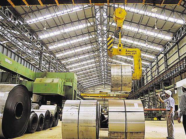 Employees work inside a steel factory in Agartala, capital of Tripura. Indian manufacturing growth cooled in June after a surge in activity the prior month, mainly due to slowing production and rapidly easing input price pressures. (Reuters Photo)