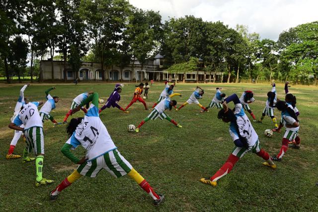 In this photograph taken on October 8, 2015, Kolsindur high school football team players stretch during a training session in Kolsindur. (AFP Photo) In this photograph taken on October 8, 2015, Kolsindur high school football team players stretch during a training session in Kolsindur. (AFP Photo)