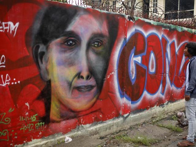 A man looks at a graffiti congratulating Myanmar's opposition leader Aung San Suu Kyi and her party's election victory in Mandalay, Myanmar. (AP) A man looks at a graffiti congratulating Myanmar's opposition leader Aung San Suu Kyi and her party's election victory in Mandalay, Myanmar. (AP)