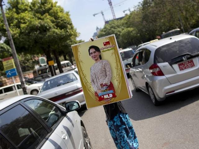 A street vendor holds a calendar featuring Myanmar's opposition leader Aung San Suu Kyi in a Yangon street, Myanmar. (AP Photo) A street vendor holds a calendar featuring Myanmar's opposition leader Aung San Suu Kyi in a Yangon street, Myanmar. (AP Photo)