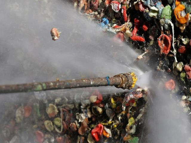 The tradition of sticking used chewing gum began back in 1993 when members of a theatre group stuck gum to the wall and placed coins in the gum blobs. (AP)