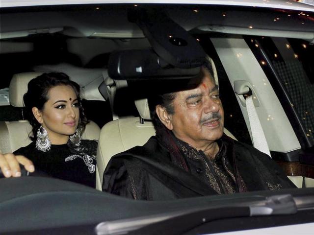 Bollywood actor and politician Shatrughan Sinha with daughter Sonakshi Singh arrives to attend Amitabh Bachchan's Diwali party, in Mumbai n Wednesday. (PTI)