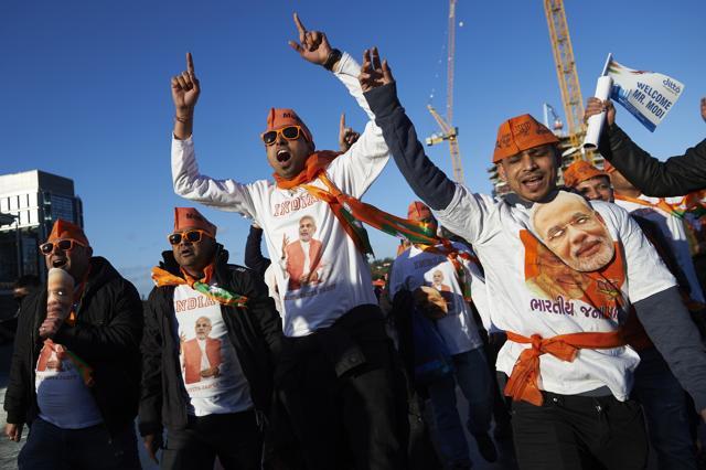 People arrive to attend a welcome rally for Prime Minister Narendra Modi at Wembley Stadium in London. (AFP) People arrive to attend a welcome rally for Prime Minister Narendra Modi at Wembley Stadium in London. (AFP)