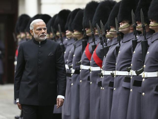 Prime Minister Narendra Modi inspects a guard of honour outside the Treasury in London on November 12, 2015 on the first day of a three-day visit to Britain. (AFP)