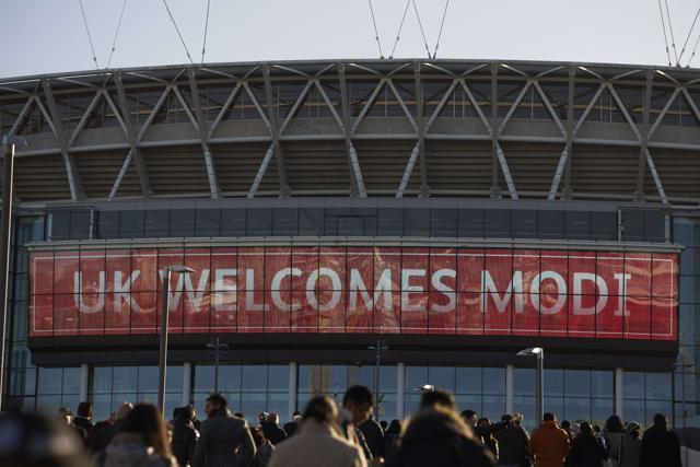 People arrive to attend a welcome rally for Prime Minister Narendra Modi at Wembley Stadium. (AFP) People arrive to attend a welcome rally for Prime Minister Narendra Modi at Wembley Stadium. (AFP)