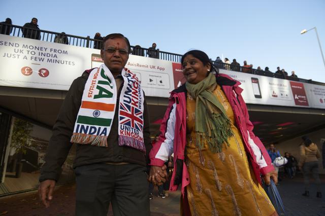 A couple arrive to attend a welcome rally for Prime Minister Narendra Modi at Wembley Stadium in London. (AFP) A couple arrive to attend a welcome rally for Prime Minister Narendra Modi at Wembley Stadium in London. (AFP)