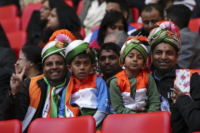 People pose in the crowd at a welcome rally for Prime Minister Narendra Modi at Wembley Stadium in London. (AFP) People pose in the crowd at a welcome rally for Prime Minister Narendra Modi at Wembley Stadium in London. (AFP)