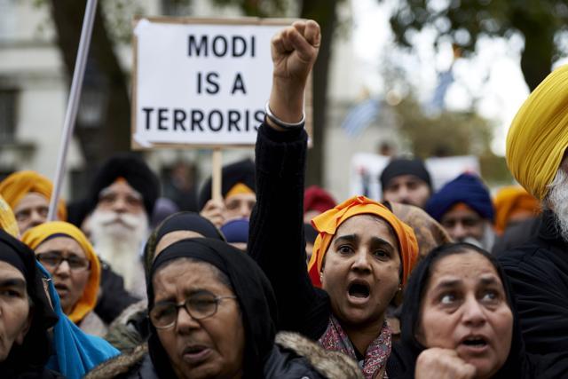 Protestors from the Sikh community demonstrate against Prime Minister Narendra Modi by Parliament square in central London . (AFP) Protestors from the Sikh community demonstrate against Prime Minister Narendra Modi by Parliament square in central London . (AFP)