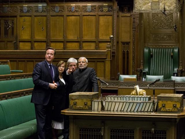 Britain's Speaker of the House of Commons John Bercow, 2nd right, gestures standing behind the dispatch box as he, British Prime Minister David Cameron, left, and Speaker House of Lords Baroness D'Souza, 2nd left, accompany Indian Prime Minister Narendra Modi on a tour of The Commons Chamber inside the Houses of Parliament in central London Thursday, Nov. 12, 2015. (AP)