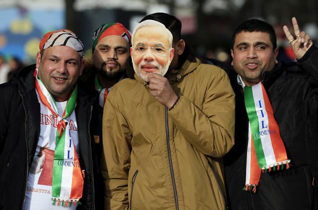 People arrive early ahead of a speech to be given by Prime Minister Narendra Modi at Wembley Stadium in north London. (AP) People arrive early ahead of a speech to be given by Prime Minister Narendra Modi at Wembley Stadium in north London. (AP)