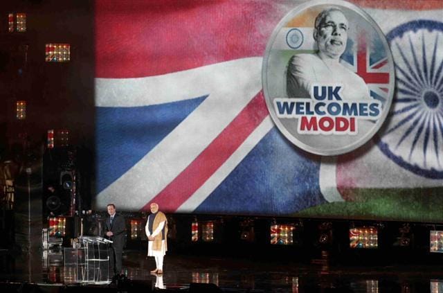 Prime Minister Narendra Modi and Britain's Prime Minister David Cameron stand on stage during an event at Wembley Stadium. (REUTERS) Prime Minister Narendra Modi and Britain's Prime Minister David Cameron stand on stage during an event at Wembley Stadium. (REUTERS)