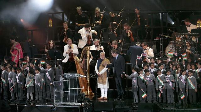 Prime Minister Narendra Modi and Britain's Prime Minister David Cameron stand on stage during an event at Wembley Stadium. (REUTERS) Prime Minister Narendra Modi and Britain's Prime Minister David Cameron stand on stage during an event at Wembley Stadium. (REUTERS)