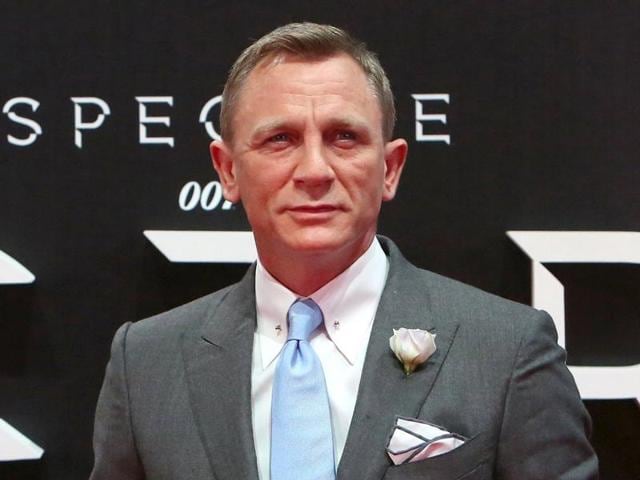 Sony released a new poster on Thursday of Spectre where Daniel Craig is seen donning a white tuxedo with a gun.